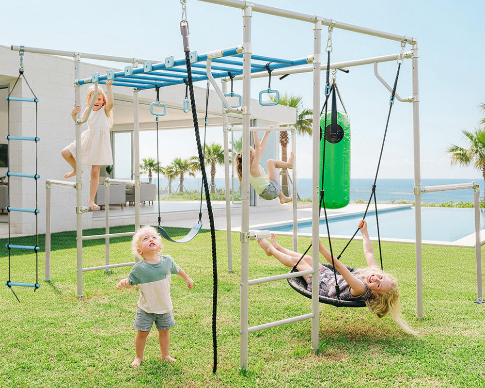 Children playing on a playground set with a pool and ocean view in the background