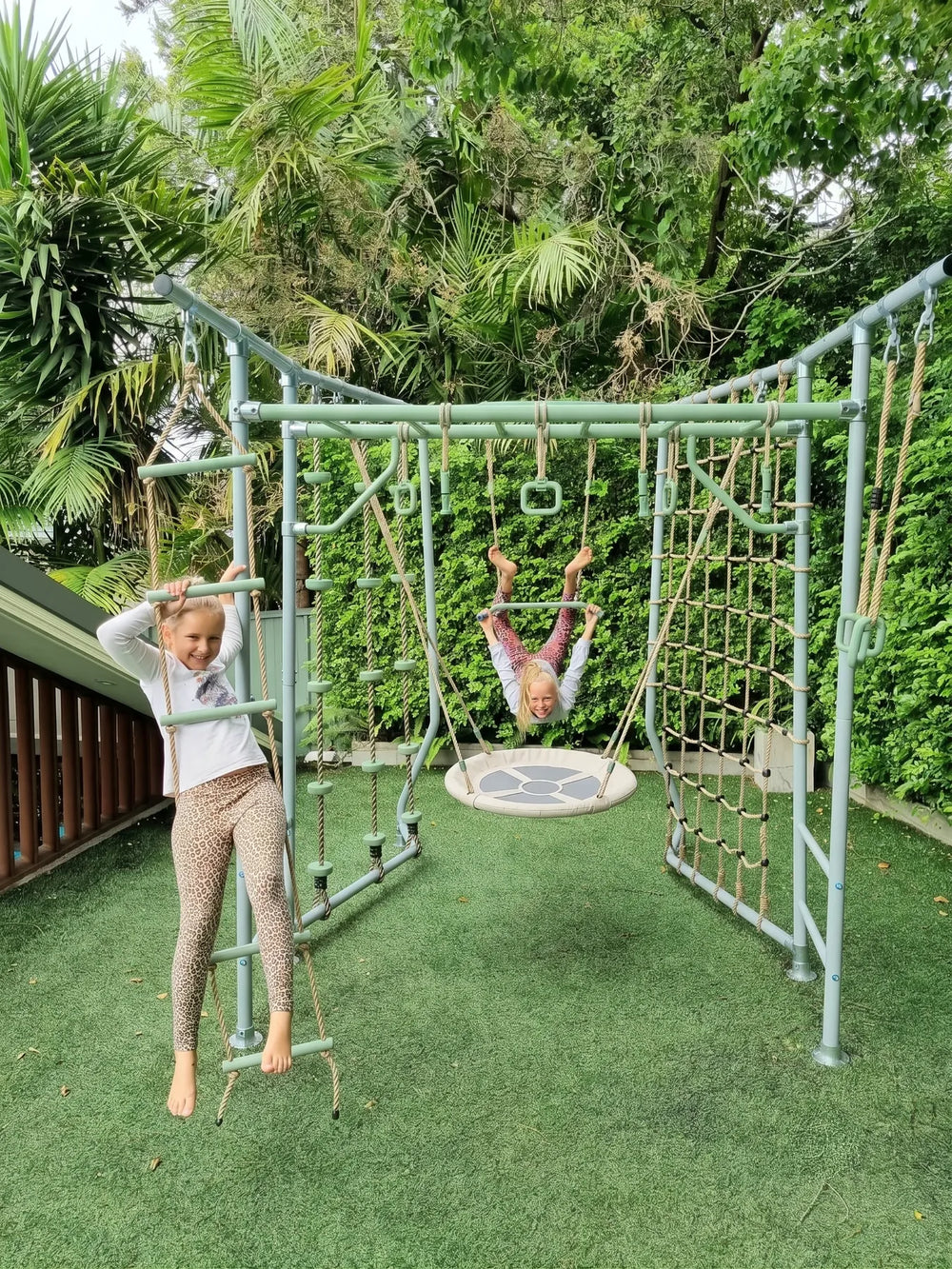 Compact green swing set for small Australian backyards