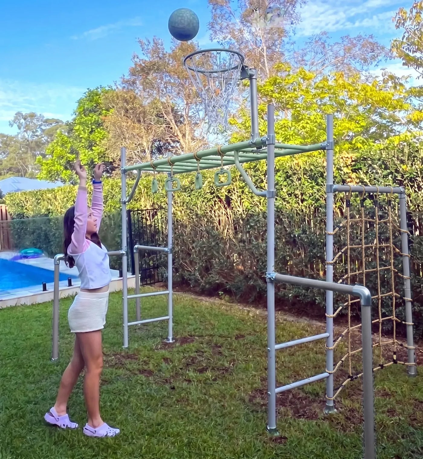 The Medium green frame in a real backyard with basketball hoop and child