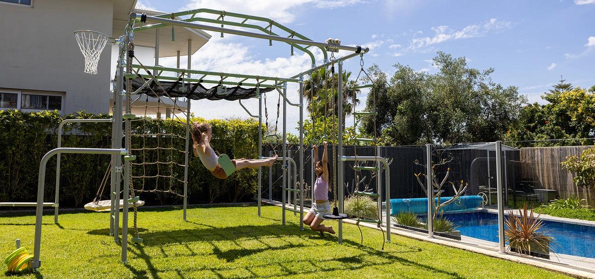 Growplay monkey bars and climbing frame in a sunny backyard