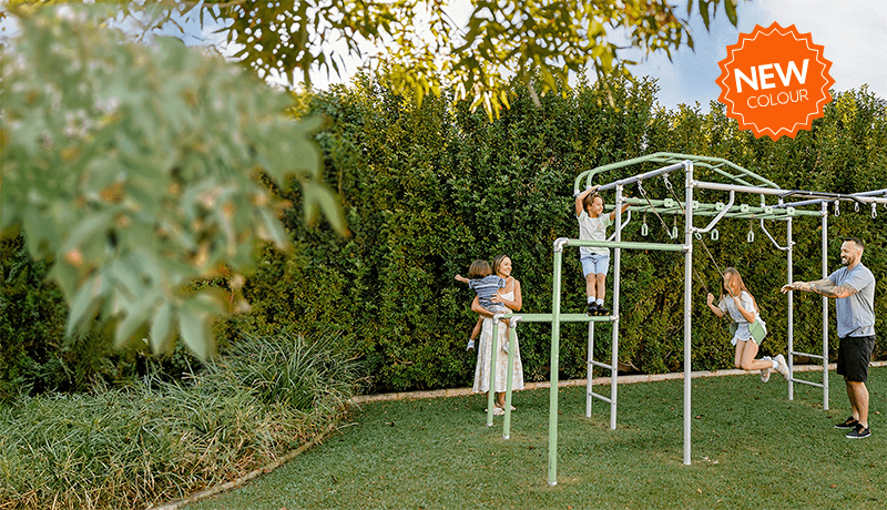 The Evergreen Growplay frame settling into a beautifully planted backyard